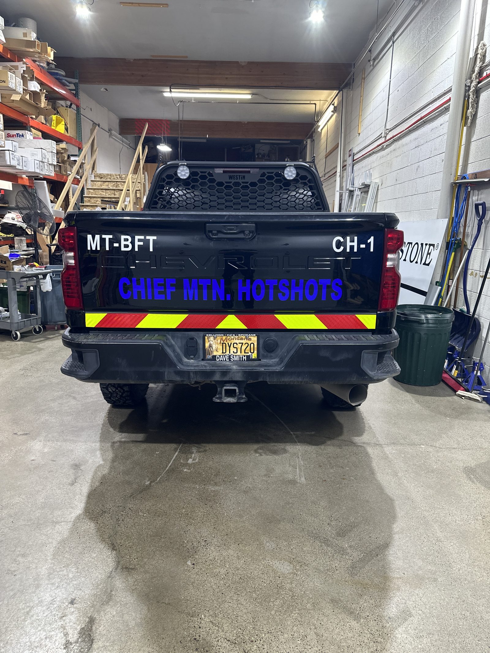 Reflective chevron striping on a fire department tailgate