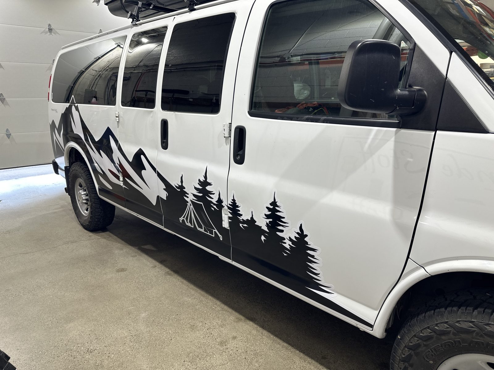 Mountain scene cut vinyl on a cargo van