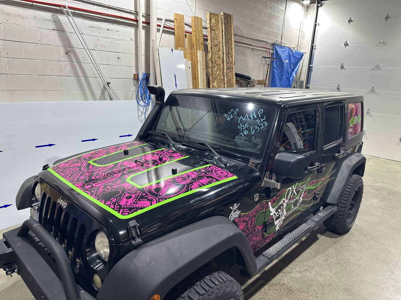 Custom camouflage wrap on a Jeep Wrangler