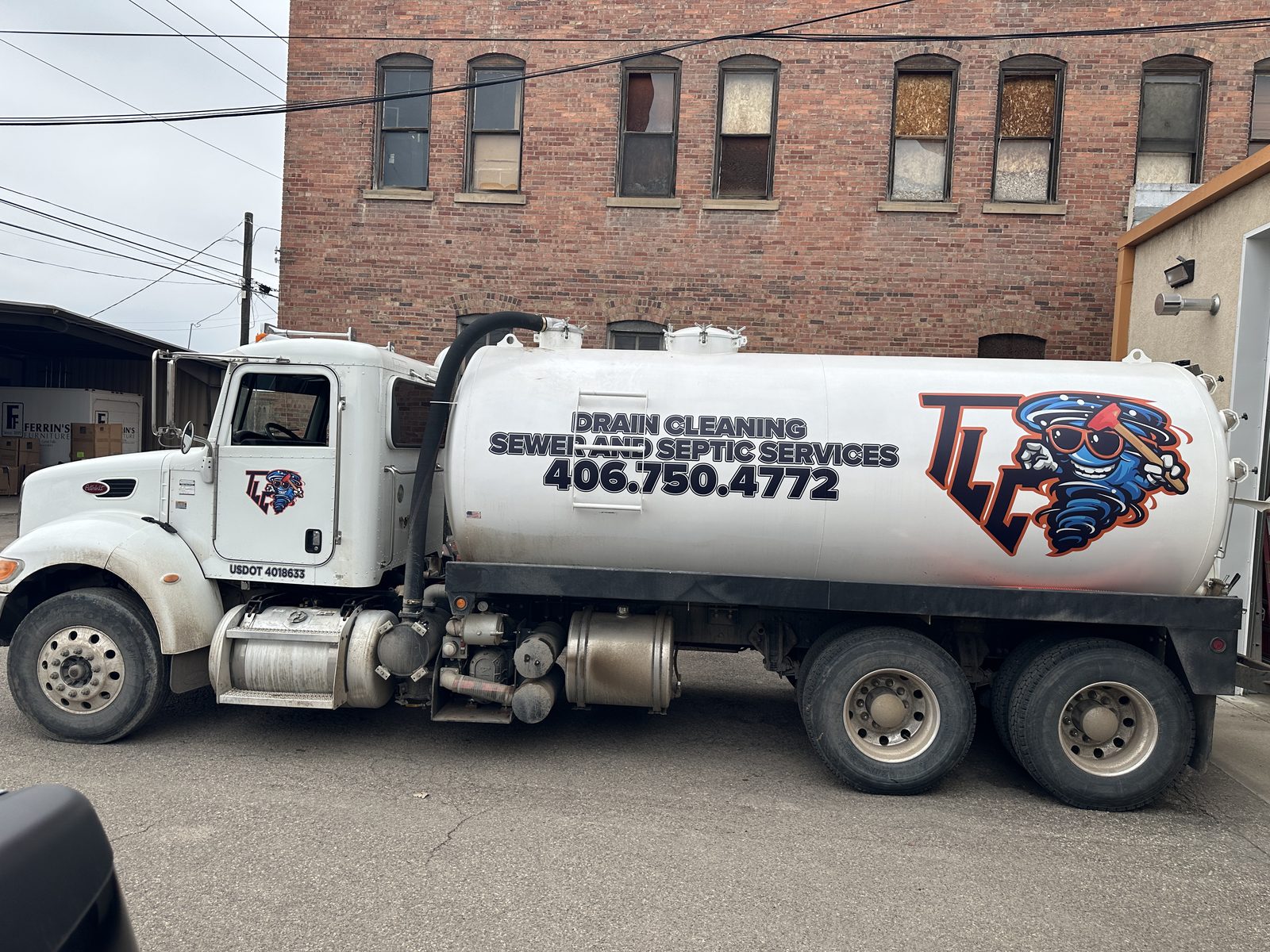 Vacuum tanker lettered for a septic services company
